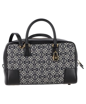 VINTAGE, RRP AS NEW
The Loewe Amazona 28 Anagram Handbag in black canvas and leather is a perfect blend of timeless elegance and contemporary style, featuring the brand’s iconic Anagram logo embossed on the front. Crafted from durable canvas and premium leather, this bag offers a sophisticated yet practical design, ideal for everyday use. Pair it with tailored trousers and a blouse for a chic office look, or style it with a casual dress and sneakers for a more relaxed, stylish vibe. The classic black canvas and leather combination ensures versatility, making it an essential accessory that complements any outfit.

Loewe Amazona 28 Anagram Handbag in Black Canvas and Leather

Condition: Excellent
Signs of wear: No retail tag, No visible sign of wear., 
Packaging: Box, Dust bag
Color: Black
Material: Canvas 
Size: One Size | One Size
Measurements: Width: 110; Height: 160; Length: 290; Handle drop: 90; Strap length: 0
SKU: NAPPUGBBA465182W