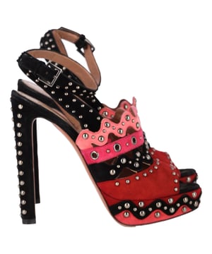 VINTAGE, RRP AS NEW
The Alaïa Studded Platform High-Heeled Sandals in Multicolor Suede are a striking fusion of bold design and luxurious craftsmanship, featuring vibrant multicolor suede and intricate studded detailing for a standout look. The platform design adds comfort and stability while the high heel creates a flattering, elongated silhouette. These sandals are perfect for making a statement at evening events or adding a pop of color to a more casual outfit. Pair them with a little black dress or wide-leg trousers to let the shoes take center stage and add a touch of glamour to your ensemble.

 Alaïa Studded Platform High-Heeled Sandals in Multicolor Suede

Condition: Very good
Signs of wear: Minor sign of wear. No Mark at insole., Lightly used but very well maintained. Minor mark at soles & creasing, light scuffing at the soles and heels.
Packaging: Dust bag
Color: Multicolor | multicolor
Material: Suede | suede
Size: IT | 37.5
Measurements: Heel height: 140; Insole length: 250
SKU: TONPUGBSH463235W