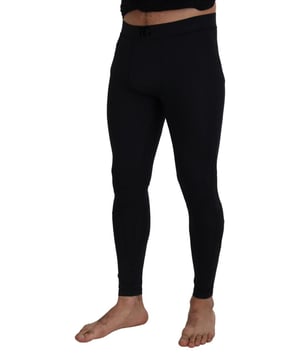 Marke: DOLCE & GABBANA  
Wunderschön und authentisch  
Neu mit Etiketten  
Aus der exklusiven MainLine-Kollektion  
Modell: Hose  
Farbe: Schwarz  
Material: 85% Nylon 15% Elastan Spandex  
Logodetails  
Made in Italy  