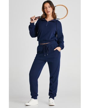 Our styles are designed with a trendy fitted look in mind following an international size standard. For the best fit we suggest choosing one size up from your usual. Be sure to check our sizing chart to find your perfect match!
  Navy blue ribbed knit cropped hoodie and drawstring joggers set
  Coordinated outfit for a stylish look
  Trendy ribbed
  knit design for a textured appearance
  Adjustable drawstring on the waist for a customized fit
  Crafted from quality fabric for ultra comfort during workouts
  Suitable for both workouts and casual wear
Material: 95% Polyester 5% Elastane
