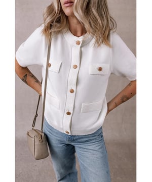 Our styles are designed with a trendy fitted look in mind following an international size standard. For the best fit we suggest choosing one size up from your usual. Be sure to check our sizing chart to find your perfect match!
  Unique gold button front design
  Textured lightweight knit fabric
  Perfect for summer wear
  Pairs well with both pants and skirts
  Available in sizes S M L and XL
  High elasticity
Material: 50% Viscose 28% Polyester 22% Polyamide