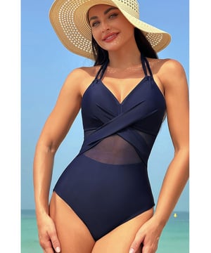 Navy Blue Halter Mesh Insert Cross Front One
  Piece Swimsuit
  Front crisscross design adds sophistication and modernity
  Halter neck style for adjustable fit and bust lift
  Mesh patch detailing adds texture and allure
  Suitable for those who prefer a more modest swimwear option
  Available in sizes S to 2XL
Material: 80% nylon 20% spandex