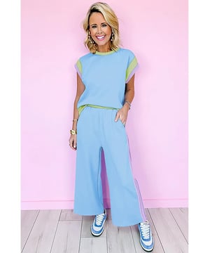 Our styles are designed with a trendy fitted look in mind following an international size standard. For the best fit we suggest choosing one size up from your usual. Be sure to check our sizing chart to find your perfect match!
  Sky Blue Color Block Detail Casual Two
  piece Outfit
  Crew neck cap sleeve tee
  Crop wide leg pants
  Eye
  catching colorblock detail
  Loose fit adaptable to most body shapes
  Made from fine fabric for warm weather
Material: 95% Polyester 5% Elastane