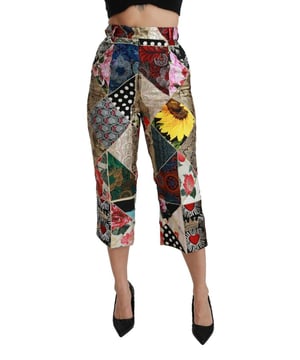 Merk: Dolce & Gabbana
  Conditie: Nieuw met tags
  Stijl: cropped broek met hoge taille
  Pasvorm: Normaal
  Materiaal: 45% Zijde 35% Viscose 20% Polyamide
  Kleur: Veelkleurig
  Gulp: Rits
  en knoopsluiting
  Details van het logo
  Vervaardigd in Itali