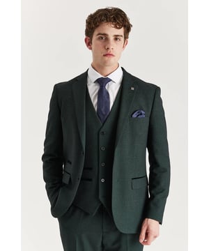 Step into refined elegance with this tailored green suit jacket, featuring a timeless Prince of Wales check. The rich green tone paired with a structured cut creates a confident and contemporary appearance, perfect for weddings, formal events, or standout office wear. Whether worn solo or with matching pieces, this blazer adds polish to any smart wardrobe.
Tailored fit blazer with structured, elegant finish
Classic Prince of Wales check in a deep green tone
Suitable for formal events or stylish professional wear
Matches perfectly with coordinating trousers and waistcoat
Material: 77% Polyester, 20% Viscose, 3% Spandex