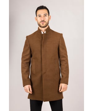 Elevate your outerwear with this refined wool blend overcoat, designed for both style and functionality. Crafted from a premium wool blend, it offers reliable warmth and durability—perfect for colder months. The sophisticated Nehru collar introduces a modern twist to classic tailoring, while the tailored fit ensures a sharp silhouette without sacrificing comfort. Finished with a discreet button closure, this coat delivers a clean, minimalist aesthetic suitable for formal and smart-casual ensembles alike.
Wool Blend Fabric: Made from 85% wool and 15% polyester for warmth, structure, and long-lasting wear.
Sophisticated Nehru Collar: Adds a distinctive and polished touch to any outfit.
Tailored Fit Design: Enhances your silhouette while maintaining comfortable movement.
Discreet Button Closure: Offers a clean, streamlined look with hidden front buttons.
Material Composition: 85% Wool, 15% Polyester.