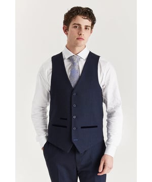 Elevate your outfit with this tailored navy waistcoat, detailed with a classic Prince of Wales check for added flair. Designed for a sharp fit and refined layering, it’s the perfect addition to your formalwear rotation. Ideal for weddings, proms, or even smart-casual looks when paired with jeans or chinos.
Smart tailored fit for a clean and polished silhouette
Elegant check pattern adds traditional charm
Rich navy hue for standout style
Wear alone or with the full 3-piece set
Material: 77% Polyester, 20% Viscose, 3% Spandex