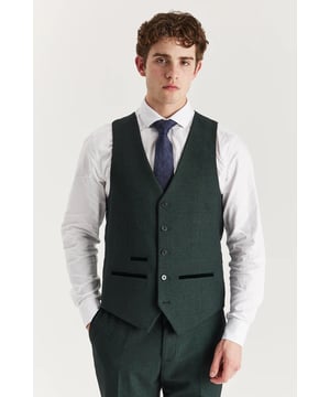 Elevate your outfit with this tailored green waistcoat, detailed with a classic Prince of Wales check for added flair. Designed for a sharp fit and refined layering, it’s the perfect addition to your formalwear rotation. Ideal for weddings, proms, or even smart-casual looks when paired with jeans or chinos.
Smart tailored fit for a clean and polished silhouette
Elegant check pattern adds traditional charm
Rich green hue for standout style
Wear alone or with the full 3-piece set
Material: 77% Polyester, 20% Viscose, 3% Spandex