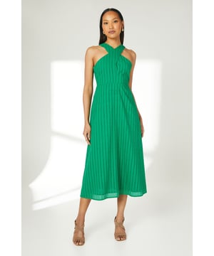 Elegant halterneck design with cross-over neckline detail for a flattering silhouette
        Delicate broderie anglaise pattern throughout adds texture and visual interest
        Midi length falls gracefully below the knee for versatile styling options
        Fully lined with cotton for comfort and breathability
        Subtle keyhole back fastening adds a refined finishing touch
    
    This charming halterneck midi dress from Principles showcases beautiful broderie detailing and a distinctive cross-over neckline that frames the dcolletage perfectly. The flowing midi silhouette creates an effortlessly feminine look whilst the cotton fabric ensures all-day comfort. Style with neutral-toned block heel sandals as seen on our model for casual garden parties or family gatherings. For cooler days, layer with a lightweight denim jacket and accessorise with delicate hoop earrings. This versatile piece transitions seamlessly from daytime brunches to evening barbecues-simply switch your footwear from flat sandals to espadrille wedges as the occasion demands. The timeless design makes it a wardrobe staple that you'll reach for throughout the warmer months.