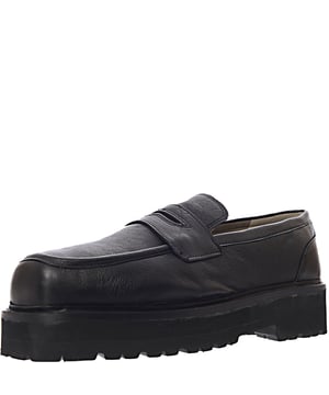 Lining: 50% Textile, Upper: 100% Real leather, Lining: 50% Real leather, Sole: 100% Other materials Step up your style game with the Asra Square Toe Chunky Loafers in sleek black leather. Featuring a 100% real leather upper and a combination of textile and real leather lining, these loafers offer both luxury and comfort. The square toe design adds a modern twist to a classic silhouette, while the chunky sole provides a bold, contemporary look. Perfect for both casual and formal occasions, these loafers effortlessly blend sophistication with a trendy edge. The versatile black color ensures they pair seamlessly with any outfit, making them a must-have addition to your footwear collection.