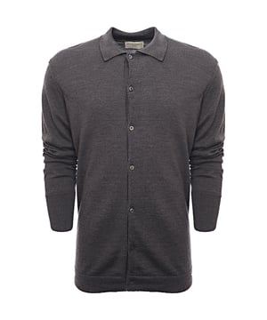 100% Virgin Wool Long sleeved button-down knitted polo. Rib stitching at cuffs with a tubular jersey at hem and side slits.