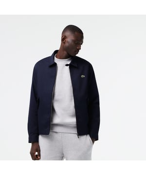 BH2591 Men's Short Zippered Organic Cotton Gabardine Jacket Organic stretch cotton gabardine and mesh lining Classic collar and zip fastening Buttoned front pockets  zip interior chest pocket  underarm eyelets  interior loops for headphones Adjustable wristbands and bottom of garment with button placket Embroidered green crocodile on chest