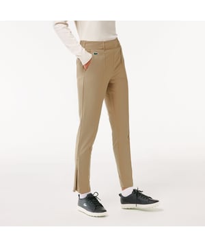 HF9363 Women's Lacoste SPORT Stretch Taffeta Golf Pants Adjusted waist:  Comfort for all your activities. Two back pockets:  For your gloves  keys and small valuables. Rigid crocodile sewn under waist:  Lacoste signature details. Lightweight stretch taffeta:  Stay cool all day long.