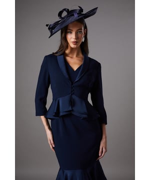 Exquisite tailored jacket crafted from satin back crepe fabric
Sophisticated peplum waist design adds a feminine flair
Structured shoulders and fitted silhouette create a flattering shape
Elegant V-neckline with button-up front closure
Versatile three-quarter length sleeves for effortless styling

This tailored jacket from Coast exudes refined elegance, making it a perfect choice for formal occasions like weddings, races, or graduations. The satin back crepe fabric drapes beautifully, while the peplum waist design adds a touch of femininity. Pair it with a tailored dress or trousers and heels for a polished and sophisticated look that will turn heads. Whether you're attending a garden party or a black-tie event, this jacket will ensure you radiate confidence and style.