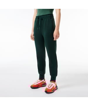 Cotton Sweatpants Organic cotton jersey and recycled polyester  limiting the production of virgin materials Tapered fit Key loop in front right pocket Printed with the geographical coordinates of Lacoste’s historic factory and headquarters Silicone crocodile