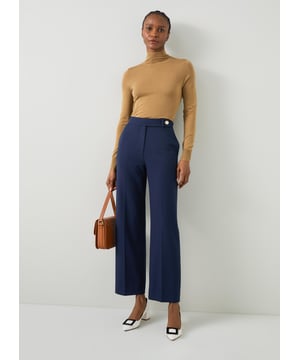 Effortlessly step into sophistication with our Billie tailored crop wide trousers. These navy workwear essentials, crafted from a high-quality fabric blend, feature a timeless plain design that exudes elegance. Perfectly pair them with a crisp white blouse or a stylish silk top for a polished look.