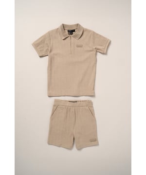 This easy set from Bench includes a ribbed polo shirt and matching shorts made from soft cotton with a bit of stretch for comfort. The ribbed texture gives it a nice finish while still being comfortable to wear. A great choice for everyday wear or casual outings.
