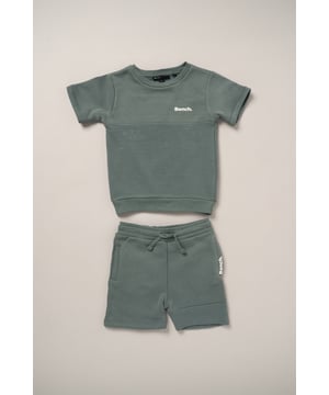 This Bench set combines a short sleeve sweatshirt with matching shorts, made from soft brushed sweat fabric for all-day comfort. Featuring ottoman rib panelling and elasticated rib hems, the outfit blends durability with a premium finish. A flat woven drawcord adds a practical detail, making this set a go-to for casual wear with a stylish edge.