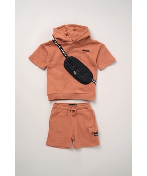 This 2-piece set from Bench includes a standout sweatshirt with a stitched imitation cross body bag detail and matching shorts for a coordinated, streetwear-inspired look. Made from soft brushed sweat fabric and finished with ribbed trims for comfort, it’s an easy go-to for laid-back days. The playful bag detail brings added personality, while the matching shorts complete the look with ease. Perfect for casual wear with a cool, urban edge.