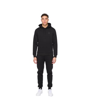 60% Baumwolle, 40% Polyester. Design: Logo, Unifarben. Taille: mit Kordelzug. Zum Überziehen. Inhalt: 1 Kapuzenpullover, 1 Hose. Taschenart: 1 Kängurutasche, Zwei Seitentaschen. Kapuzenmerkmale: mit Kordelzug, Aufnähen. Mit Kapuze. Langärmlig. S: 96,52 cm. M: 102 cm. L: 107 cm. XL: 112 cm. XXL: 116,84 cm.