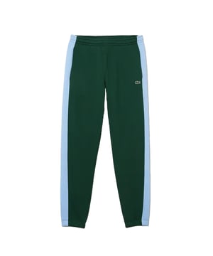 80% Katoen, 20% Polyester. Stof: Vlies. Ontwerp: Contraststreep, geborduurd logo. Stoftechnologie: Zacht. Zakken: 2 Zijzakken, 1 Achterzak. Tailleband: Koord, Elastisch. Geschikt voor: Taps toelopend. Manchet: Elastiek.
