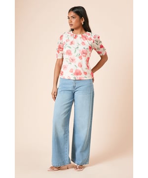 Delicate gathered neckline creating a soft, feminine silhouette
        Elegant puff sleeves with gentle volume for a romantic touch
        Lightweight mesh fabric offering comfortable breathability
        Flattering regular fit designed specifically for petite frames
        Versatile crew neckline that works beautifully for layering
    
    This charming floral mesh top from Dorothy Perkins combines timeless femininity with contemporary style. The gathered neckline adds a subtle sophistication while the puff sleeves create a romantic silhouette that's both on-trend and flattering. Perfect for casual gatherings, style this versatile piece with wide-leg denim trousers and flat sandals for weekend brunches with friends. For family celebrations, tuck it into a flowing midi skirt and add delicate jewellery for an effortlessly put-together look. The regular fit is designed to flatter the petite frame without overwhelming your proportions. This top transitions seamlessly from day to evening - simply swap your casual footwear for a pair of ballet flats and add a structured handbag for an elegant finish that maintains the top's inherent wearability.