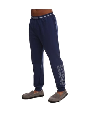 100% Baumwolle. Gewebe: Sweatshirt-Stoff. Design: Kontraststreifen, Logo. Gewebetechnik: Leicht. Seitennähte. Taschenart: Zwei Seitentaschen. Taille: Mit Markenzeichen, Elastisch, Jacquard-Taillenbund. Passform: Regulär. Saum: gerippt.