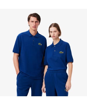 Loose Fit L.12.12 Piqué Badge Poloshirt Piqué van organisch katoen Loose fit met afhangende schouders Klassieke polokraag Echte parelmoerknopen Grote krokodillenbadge op de borst