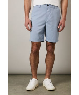 Textured woven fabric adds subtle dimension and visual interest
        Classic chino design with clean-cut finish for versatile styling
        Mid-thigh length offering comfortable coverage
        Flat front design creates a sleek, contemporary silhouette
        Rear pocket detailing for practical everyday wear
    
    These Maine textured chino shorts combine comfort with casual sophistication. The clean lines and tailored fit make them an essential addition to your warm-weather wardrobe. Style them as shown with a crisp white t-shirt and trainers for effortless weekend outings, or pair with a linen shirt and loafers for garden parties and family gatherings. The versatile design transitions seamlessly from daytime casual to evening relaxed events. Perfect for holidays abroad or British summer days, these shorts offer both comfort and style without compromising on quality. The textured fabric adds a refined touch that distinguishes them from ordinary shorts, making them ideal for those who appreciate subtle details in their casual attire.