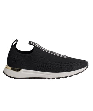 Easy to wear. Easy to style. The Bodie sneakers are updated with a slip-on silhouette that exudes sophisticated style with a casual touch. They're made from stretch knit for breathability, while the MK initials and logo tab at the top give the design a fresh look. Wear them with denim or this season's printed skirts.\n\n Details:\n - Almond tip.\n - Stretch knit fabric.\n - Padded textile insole.\n - No laces.\n - Michael Kors logo at the instep loop.\n\n A good pair of women's designer sneakers will take you anywhere. Whether you're going for a stroll, exploring the city, or taking a long trip, casual women's sneakers allow you to arrive at your destination in style. If you're looking for a revamped take on a classic, high-top designer sneakers are the best option. Sneakers with a retro-inspired silhouette look great with both cropped jeans and minidresses. For traveling, slip-on sneakers are the best option. They're ideal for slipping on and off during security, as well as for great comfort while exploring a new city.\n Composition: 50% Polyester, 35% Spandex, 15% Adhesive\n Care:\nUse a soft, damp cloth to clean the surface.