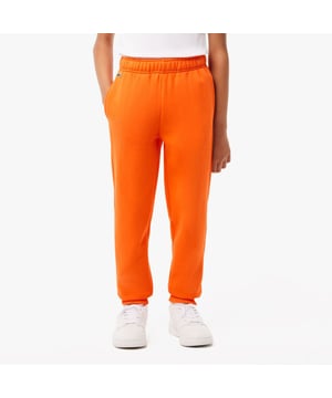 Fleece Sweatbroek Organisch geborsteld katoenen fleece en gerecycled polyester Verborgen zijzakken Elastische taille met trekkoord Elastische enkels voor betere pasvorm Geborduurde krokodil