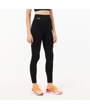 Dames Lacoste SPORT Seamless Absorberende Sport Leggings in zwart. Niets zal je kunnen stoppen in deze tweede-huid stijl legging. Naadloos: geen vlekken, geen schuurplekken, maximaal comfort! Ondersteunend maar niet beperkend gemaakt om je droog te houden.- Stretch jacquard- Getest en goedgekeurd door sporters- Tweekleurige siliconen krokodil- Polyamide (93%) Elastaan (7%).  Machinewasbaar.- Ref: OF1022-031In onze ervaring valt dit model klein uit. U kunt een maat groter kiezen dan u normaal zou bestellen. Dit advies is alleen bedoeld als richtlijn.