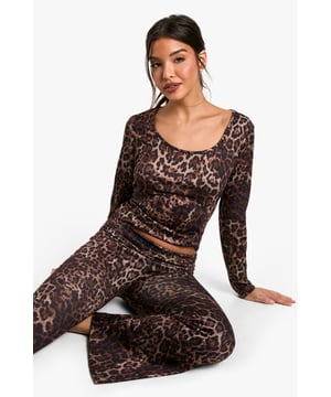 Eye-catching all-over pattern for a bold loungewear look
        Flattering round neckline adds a touch of elegance
        Long sleeves provide warmth and comfort
        Figure-hugging silhouette accentuates curves
        Versatile piece that can be mixed and matched with other loungewear items
    
    Embrace your wild side with this striking patterned loungewear top from Boohoo. Perfect for those lazy days at home or cosy nights in, this knitted piece offers both style and comfort. The form-fitting design showcases your silhouette, while the round neckline adds a touch of sophistication. Pair it with the matching bottoms for a coordinated look, or mix it up with solid-coloured joggers for a more relaxed vibe. Layer it under a chunky cardigan when the temperature drops, or wear it on its own for a bold statement. Whether you're binge-watching your favourite series or having a casual catch-up with friends, this top ensures you'll look effortlessly chic while feeling utterly comfortable.