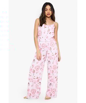 Charming all-over print featuring playful motifs
        Comfortable knitted fabric for a soft feel
        Adjustable spaghetti straps for a customised fit
        Wide-leg trousers for unrestricted movement
        Versatile two-piece set for mix-and-match styling
    
    Drift off to dreamland in style with this delightful nightwear set from Boohoo. The charming all-over print adds a touch of whimsy to your bedtime routine, while the knitted fabric ensures a cosy night's sleep. The adjustable spaghetti straps allow you to find your perfect fit, and the wide-leg trousers offer ample room for movement as you lounge or slumber. This versatile set is perfect for those warm summer nights when you want to feel cool and comfortable. Pair the top with your favourite pyjama bottoms or wear the trousers with a simple vest for a mix-and-match look. Whether you're having a leisurely weekend lie-in or getting ready for a girls' night in, this adorable set will keep you feeling relaxed and looking effortlessly chic.