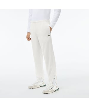 XH1618 Showerproof Sportsuit Track Pants Gerecycled polyester gemaakt van snijafval Regelmatige pasvorm recht model Taille met koord Mesh voering tot knie Geborduurde krokodil op achterkant Showerproof Sportsuit Track Pants Gerecycled polyester gemaakt van snijafval Regelmatige pasvorm recht model Taille met koord Mesh voering tot knie Geborduurde krokodil op achterkant