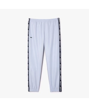 XH7587 Sportsuit Gevoerde Tennis Track Pants Gerecycled polyester gemaakt van afval van productie Regelmatige pasvorm Recht model Jersey voering Contrast logo strepen Siliconen krokodil op zijkant Sportsuit Gevoerde Tennis Track Pants Gerecycled polyester gemaakt van afval van productie Regelmatige pasvorm Recht model Jersey voering Contrast logo strepen Siliconen krokodil op zijkant