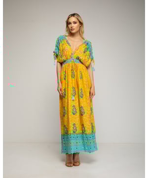 Mouwloze maxi-jurk met print, pailletten en borduursel op de borst en veterdetail. Vainica aan de zoom