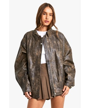 Vintage-inspired faux leather biker jacket
        Oversized fit for a relaxed, effortless look
        Distressed finish adds character and edge
        Zip-up front closure for easy wear
        Ribbed hem and cuffs for a snug fit
    
    Channel your inner rebel with this vintage-inspired faux leather biker jacket. The oversized silhouette offers a contemporary twist on a classic style, perfect for those who want to make a statement. The distressed finish gives the jacket a lived-in look, adding depth and character to your ensemble. Pair it with a crisp white tee and pleated mini skirt for a chic contrast, or throw it over a flowy maxi dress to add some edge to a feminine look. For casual outings, team it with your favourite jeans and ankle boots. This versatile piece is ideal for family gatherings, brunches with friends, or a night out at your local pub. The faux leather material ensures easy care, making it a practical choice for the fashion-forward woman who values both style and convenience.