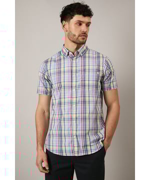 Classic button-down collar for a refined casual look
        Vibrant Bermuda check pattern perfect for the summer season
        Convenient chest pocket for added functionality
        Short sleeves with neat finishing for warm-weather comfort
        Back pleat detail allowing for enhanced movement and fit
    
    This Maine Bermuda check shirt brings a splash of personality to your casual wardrobe. The cheerful pattern creates a relaxed yet put-together aesthetic that works brilliantly for daytime socialising. Style with dark shorts as shown for a balanced summer look, or pair with chinos for garden parties and family gatherings. The cotton-rich fabric offers breathability and comfort during warmer months, making it ideal for outdoor brunches or coastal walks. For a complete ensemble, match with white trainers and sunglasses for an effortlessly cool finish. This versatile shirt transitions seamlessly from daytime casual to evening barbecues - simply add a lightweight jacket as temperatures cool. A true seasonal staple that brings character to your everyday rotation without compromising on comfort.