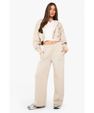 Distinctive pintuck detailing adds texture and visual interest to these straight leg joggers
        Soft fleece-back fabric provides comfort without compromising on style
        Straight leg silhouette offers a modern, relaxed fit that flatters all body types
        Practical side pockets for keeping essentials close at hand
        Wide leg opening creates a contemporary silhouette that pairs perfectly with trainers
    
    These pintuck detail straight leg joggers from Boohoo blend comfort with contemporary style for the fashion-forward woman. The structured pintuck detailing elevates these joggers beyond typical loungewear, making them versatile enough for various casual settings. Style them as seen with a cropped jacket and simple white top for an effortlessly cool daytime look, or dress them up with a fitted bodysuit and chunky jewellery for casual evening gatherings. The straight leg design creates a flattering silhouette that works beautifully with both chunky trainers and flat sandals. Perfect for family gatherings, weekend brunches, or casual shopping trips, these joggers offer the ideal balance of comfort and style. The soft fleece-back fabric ensures all-day wearability while maintaining shape throughout multiple wears, making these joggers a wardrobe essential for the style-conscious woman who values both fashion and function.
