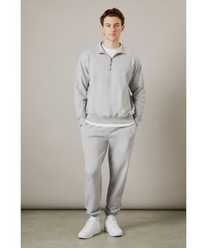 Soft jersey fabric for all-day comfort and ease of movement
        Relaxed fit through the leg with tapered ankle cuffs
        Adjustable drawstring waist for a customised fit
        Side pockets for practicality and casual styling
        Versatile design that pairs effortlessly with both casual and athleisure wear
    
    These classic jersey joggers deliver the perfect balance of comfort and style for the modern man. The relaxed silhouette offers unrestricted movement while the tapered ankle creates a more refined finish than traditional tracksuit bottoms. As demonstrated by our model, they pair brilliantly with a matching quarter-zip sweatshirt and crisp white trainers for a coordinated look that works for weekend errands or meeting mates at the local. The soft jersey fabric makes these joggers ideal for lounging at home, but they're equally suited to casual outings or sports activities. Their understated design means they'll integrate seamlessly into your existing wardrobe, working well with everything from simple t-shirts to lightweight jackets when the weather turns. A true wardrobe essential that combines practicality with laid-back style.