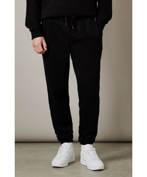 Soft jersey fabric for all-day comfort and ease of movement
        Tapered leg design with ribbed ankle cuffs for a modern silhouette
        Adjustable drawstring waistband for a personalised fit
        Relaxed through the thigh with a streamlined finish
        Versatile design that pairs effortlessly with both casual and athleisure looks
    
    These Burton jersey joggers deliver the perfect balance of comfort and style for the modern man. The relaxed fit through the thigh transitions to a tapered leg, creating a flattering shape that works for various body types. Style them with a matching sweatshirt and white trainers for a coordinated weekend look, as shown, or pair with a simple t-shirt for casual pub outings with mates. The understated design makes these joggers an excellent choice for watching the match, weekend errands, or relaxed family gatherings. Their versatility extends to travel wear - comfortable enough for long journeys yet smart enough to arrive looking put-together. A wardrobe essential that bridges the gap between loungewear and casual daywear, these joggers will quickly become your go-to for laid-back occasions.