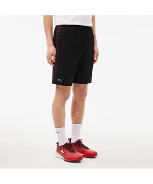 Diamond Taffeta Tennis Shorts Recycled polyester diamond taffeta  limiting the production of virgin materials Regular  straight cut Adjustable drawstring waist Short cut: crotch height 21 cm Silicone crocodile on side
