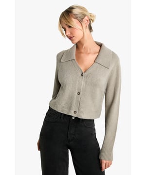 Chic collared neckline for a sophisticated touch
        Cropped length perfect for high-waisted bottoms
        Button-front closure for versatile styling options
        Ribbed cuffs and hem for a snug fit
        Relaxed silhouette offering comfort and style
    
    This stylish knit cardigan is a versatile addition to your wardrobe, perfect for layering in any season. The collared neckline adds a refined touch, making it suitable for both casual outings and slightly dressier occasions. Pair it with high-waisted trousers and trainers for a laid-back look, or dress it up with a midi skirt and ankle boots for a family gathering. The cropped length is ideal for accentuating your waistline, while the button-front closure allows for customisable coverage. For a trendy ensemble, layer it over a fitted turtleneck and wide-leg jeans, completing the look with statement earrings. This cardigan's adaptable nature makes it a go-to piece for creating numerous outfits, from relaxed weekend brunches to casual Fridays at the office.