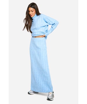 Ribbed texture for added visual interest and warmth
        Cosy roll neck design for ultimate comfort
        Coordinating crop top and maxi skirt set
        Versatile two-piece ensemble for mix-and-match styling
        Relaxed fit for effortless movement and layering
    
    Embrace laid-back luxury with this ribbed roll neck and maxi skirt co-ord set. The textured fabric adds depth to your look while ensuring you stay snug during cooler days. Perfect for casual outings or relaxed gatherings, this ensemble offers endless styling possibilities. Pair the crop top with high-waisted jeans for a trendy daytime look, or wear the set together for a chic, coordinated appearance. For a casual yet put-together outfit, team with chunky trainers and a crossbody bag. When the temperature drops, layer with an oversized denim jacket or a longline cardigan for added warmth. This versatile co-ord set is ideal for creating effortless, fashion-forward looks that transition seamlessly from day to night.