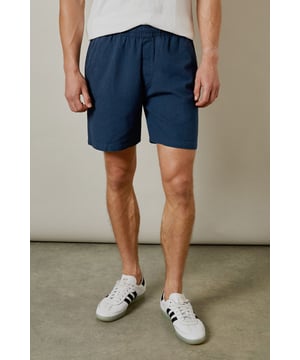 Textured woven fabric with distinctive marl finish for added visual interest
        Comfortable elasticated waistband for an easy, relaxed fit
        Practical back pocket for essential items
        Mid-thigh length offering the perfect balance between comfort and style
        Versatile navy hue that pairs effortlessly with your existing wardrobe
    
    These Burton textured casual shorts deliver the perfect combination of comfort and laid-back style for the modern man. The cotton fabric provides breathability for those warmer days, whether you're heading to a weekend BBQ or watching the match at your local. Style them as shown with a crisp white t-shirt and trainers for an effortless daytime look, or pair with a short-sleeved shirt for casual gatherings with friends and family. The relaxed fit ensures all-day comfort without compromising on style, making these shorts a versatile addition to your summer rotation. They're ideal for sporting events, pub garden sessions, or simply lounging at home. Machine washable at 30 degrees, these shorts offer practicality alongside their casual charm - a true wardrobe essential for the British summer.