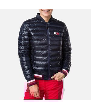 Main Fabric: 100% Polyamide. The quilted jacket adds extra warmth under your ski jacket and can be worn on its own anytime you need a warm layer. The iconic Rossignol rooster is superimposed over the Tommy Hilfiger logo celebrating the brand collaboration. Tricolor rib-knit cuffs and at the waist evoke the Rossignol's sporty, French roots