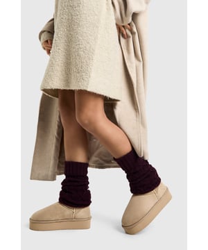 Cosy cable knit leg warmers for added warmth
        Versatile fold-over cuff for adjustable length
        Intricate diamond pattern adds textural interest
        Ribbed detailing for a snug, comfortable fit
        Perfect for layering over boots or trainers
    
    Embrace the chilly season in style with these charming cable knit leg warmers. The intricate diamond pattern and ribbed detailing not only add visual interest but also provide a snug fit to keep you warm. These versatile accessories can be styled in multiple ways - scrunch them down for a relaxed look or pull them up for maximum coverage. Pair them with your favourite boots and a cosy jumper dress for a trendy autumn ensemble. Alternatively, layer them over leggings and trainers for a casual weekend look. Whether you're heading to a bonfire night or simply running errands on a brisk day, these leg warmers are the perfect blend of fashion and function, adding a touch of cosiness to any outfit.