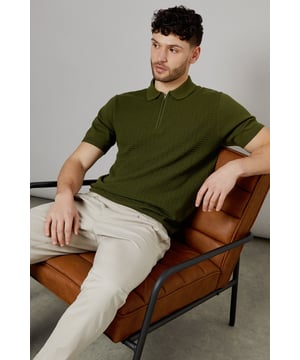 Textured knit design for added visual interest
        Quarter-zip collar for versatile styling options
        Short sleeves ideal for warmer weather
        Ribbed collar and cuffs for a snug fit
        Relaxed fit through the body for comfort
    
    This textured knitted polo from Burton offers a modern twist on a classic style. Perfect for the man who appreciates timeless fashion with a contemporary edge. The quarter-zip collar allows for customisable comfort, making it suitable for various casual occasions. Pair it with chinos and loafers for a smart-casual look at family gatherings, or dress it down with jeans and trainers for a relaxed pub outing with mates. The versatile design transitions seamlessly from daytime errands to evening drinks. Its relaxed fit ensures all-day comfort, whether you're cheering on your favourite team or enjoying a weekend barbecue. Easy to care for and effortlessly stylish, this polo is set to become a staple in any discerning gent's wardrobe.