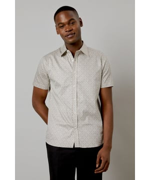Distinctive all-over print design
        Classic short sleeve silhouette
        Comfortable woven cotton fabric
        Versatile button-up style
        Tailored fit for a smart-casual look
    
    This Burton short sleeve shirt is the perfect addition to your casual wardrobe. The distinctive all-over print adds character to this classic piece, making it ideal for various occasions. Whether you're heading to the pub with mates or attending a family gathering, this shirt has you covered. Style it with dark trousers and trainers for a laid-back yet put-together look, as shown in the images. For a more relaxed vibe, leave it unbuttoned over a plain t-shirt. The woven cotton fabric ensures comfort throughout the day, while the tailored fit creates a smart silhouette without compromising on ease of movement. This versatile shirt is a must-have for the modern British gent who appreciates timeless style with a contemporary twist.